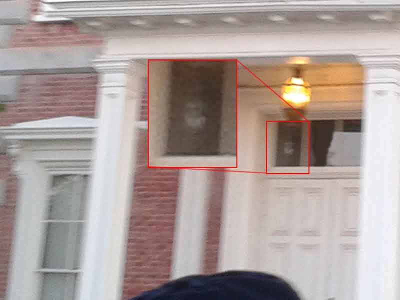 Ghost in the front window of the courthouse.
